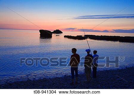 france, normandiue, etretat: pêcheur et plagel la nuit View Large Photo Image Picture - france, normandiue, etretat: pêcheur et plagel la nuit. Fotosearch
