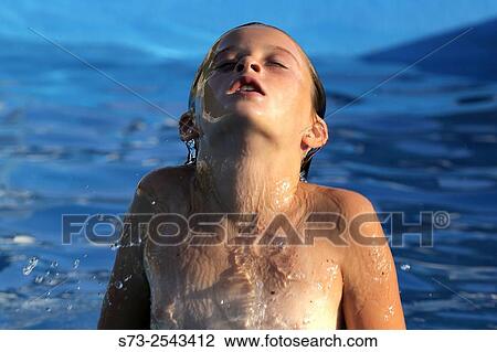 Stock Image - Girl in swimming pool. Fotosearch