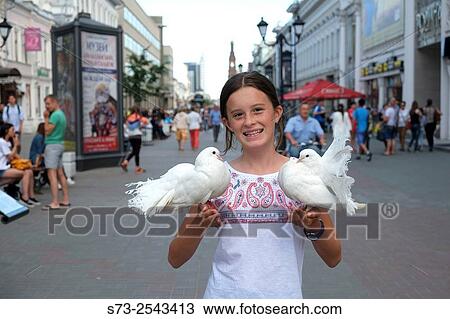 Girl with white doves, Baumana Street, Kazan, Tatarstan, Russia View Large Photo Image Stock Image - Girl with white doves, Baumana Street, Kazan, Tatarstan, Russia. Fotosearch