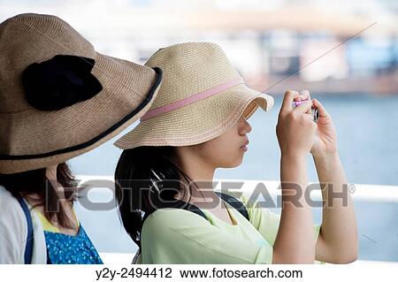 Stock Image - Girls with hat. Fotosearch