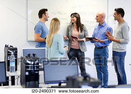 Stock Image - Group of teachers. Computer Academy.. Fotosearch