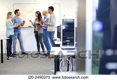 Stock Image - Group of teachers. Computer Academy.. Fotosearch