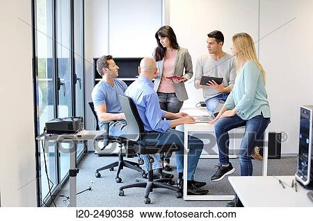 Stock Photo - Group of teachers. Computer Academy.. Fotosearch
