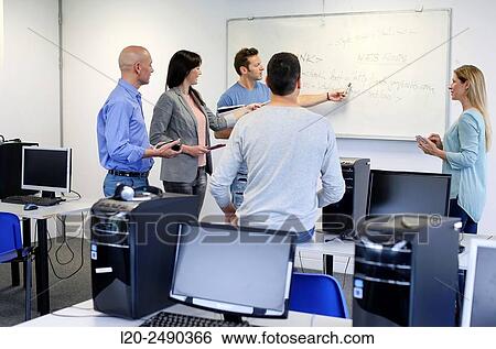 Stock Photograph - Group of teachers. Computer Academy.. Fotosearch