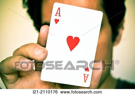 Hand holding a card ace of hearts. Face out of focus. View Large Photo Image Stock Photograph - Hand holding a card ace of hearts. Face out of focus.. Fotosearch