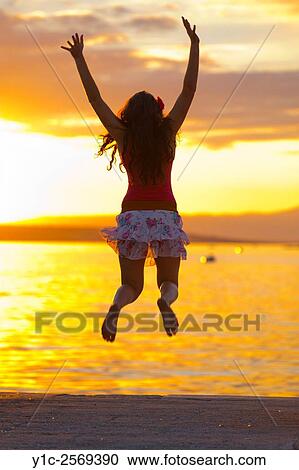 Stock Image - Happiness and sunset.. Fotosearch