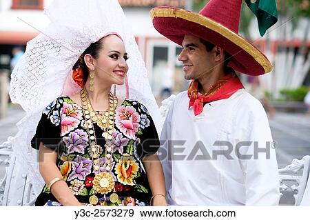 Hispanic man and woman looking at each other. Puerto Vallarta, Jalisco, Mexico. Xiutla Dancers - a folkloristic Mexican dance group in traditional costumes representing the culture and different regions of Mexico. View Large Photo Image Stock Photo - Hispanic man and woman looking at each other. Puerto Vallarta, Jalisco, Mexico. Xiutla Dancers - a folkloristic Mexican dance group in traditional costumes representing the culture and different regions of Mexico.. Fotosearch