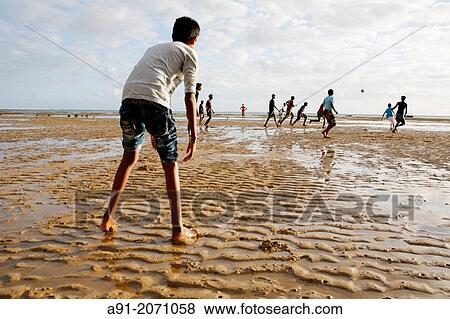 Indian Ocean, Mauritius island, South bank, Bel Ombre village, children playing footballon the beach View Large Photo Image Stock Photo - Indian Ocean, Mauritius island, South bank, Bel Ombre village, children playing footballon the beach. Fotosearch