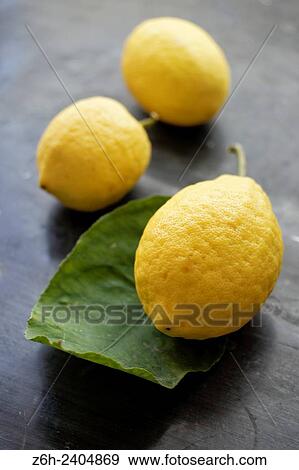 Lemons on table. View Large Photo Image Stock Photo - Lemons on table.. Fotosearch
