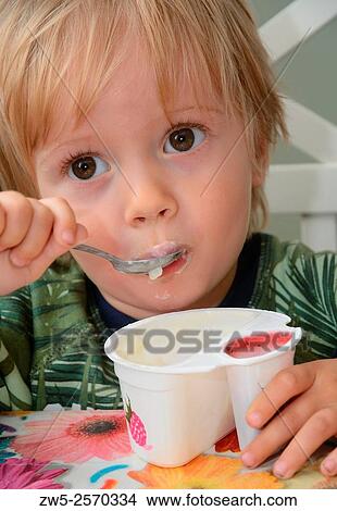 Little boy, 2½ years old, having lunch. View Large Photo Image Picture - Little boy, 2½ years old, having lunch.. Fotosearch