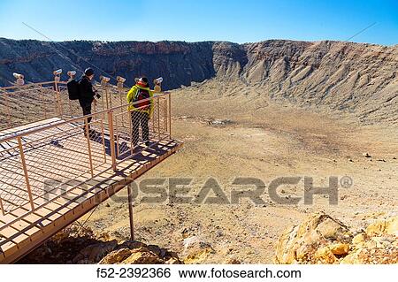 Meteor Crater is a meteorite impact crater. The site was formerly known as the Canyon Diablo Crater, Arizona, USA. View Large Photo Image Stock Photograph - Meteor Crater is a meteorite impact crater. The site was formerly known as the Canyon Diablo Crater, Arizona, USA.. Fotosearch