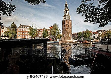 Montelbaanstoren Tower on the Oudeschans canal near Prins-Hedrichkade in Amsterdam. View Large Photo Image Stock Photograph - Montelbaanstoren Tower on the Oudeschans canal near Prins-Hedrichkade in Amsterdam.. Fotosearch