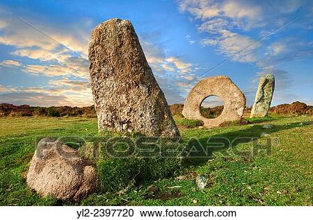 Mên-an-Tol or Men an Toll locally as the Crick Stone, late Neolithic or early Bronze Age standing stones, near the Madron, Penwith peninsula, Cornwall, England. View Large Photo Image Stock Image - Mên-an-Tol or Men an Toll locally as the Crick Stone, late Neolithic or early Bronze Age standing stones, near the Madron, Penwith peninsula, Cornwall, England.. Fotosearch