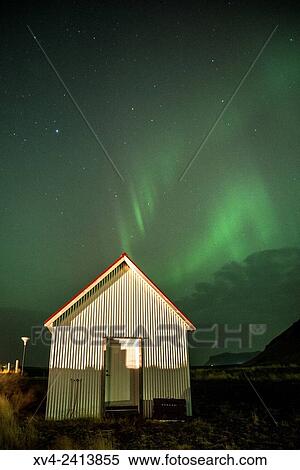 Northern lights above of houses of small village. Southern Iceland. View Large Photo Image Stock Photography - Northern lights above of houses of small village. Southern Iceland.. Fotosearch