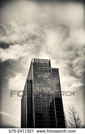 Office building with clouds in the sky in Canary Wharf, London, England, UK, Europe View Large Photo Image Stock Image - Office building with clouds in the sky in Canary Wharf, London, England, UK, Europe. Fotosearch