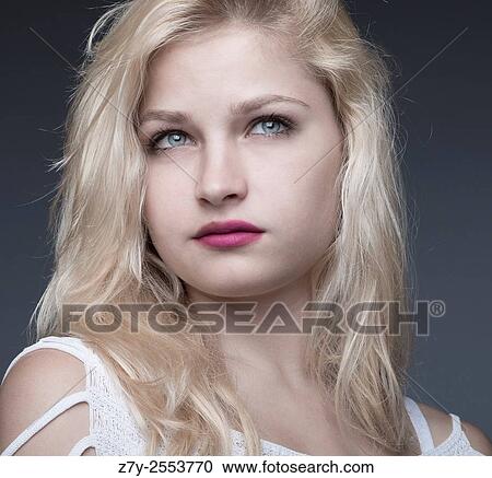 Stock Image - Portrait of a russian young teen model with blue eyes.. Fotosearch