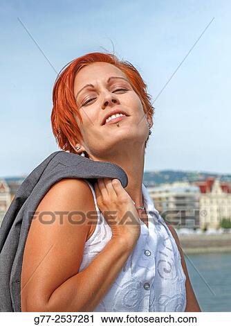 Portrait or a woman with red hair View Large Photo Image Stock Image - Portrait or a woman with red hair. Fotosearch