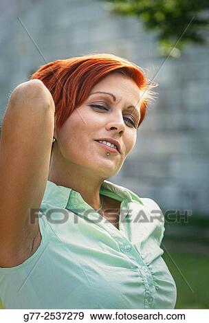 Portrait or a woman with red hair View Large Photo Image Stock Photo - Portrait or a woman with red hair. Fotosearch
