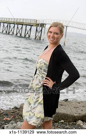 Pretty 20-something women along a coastline View Large Photo Image Stock Photo - Pretty 20-something women along a coastline. Fotosearch