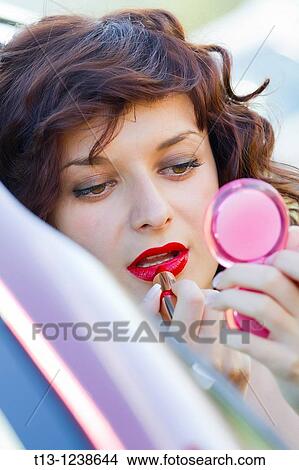 Red lips make-up ad-hoc in a car View Large Photo Image Picture - Red lips make-up ad-hoc in a car. Fotosearch
