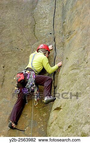 Stock Image - Rock climber Alicia Huddelson in New River Gorge National River West Virginia. Fotosearch