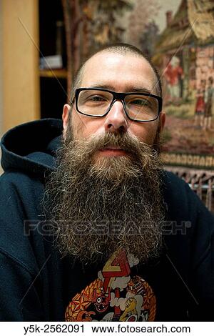 Rotterdam, Netherlands. Close up portrait of a middle aged man with large beard, wearing glasses. View Large Photo Image Stock Image - Rotterdam, Netherlands. Close up portrait of a middle aged man with large beard, wearing glasses.. Fotosearch