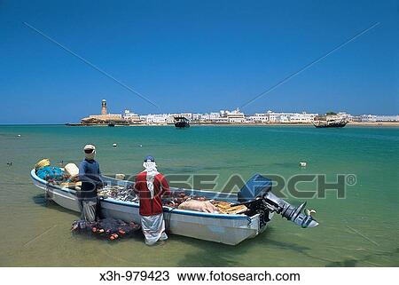 Stock Image - rowing fishing boat on the beach of Sur, Sultanate of Oman, Arabian Peninsula, Asia. Fotosearch