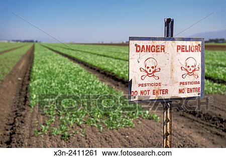 Stock Image - SALINAS, CALIFORNIA - Pesticide warning sign.. Fotosearch