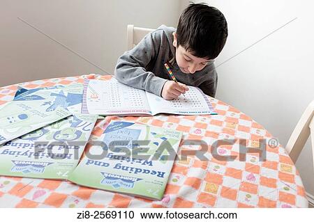 Schoolboy learning at home. View Large Photo Image Stock Image - Schoolboy learning at home.. Fotosearch