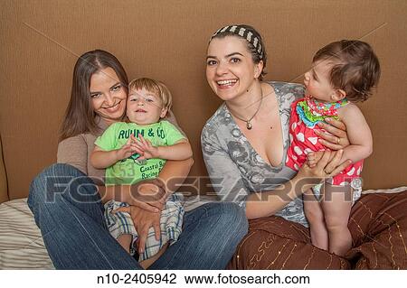 Sisters with their young son and daughter. View Large Photo Image Stock Image - Sisters with their young son and daughter.. Fotosearch