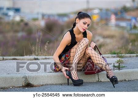 Stock Photography - Stock Photo - Pretty teen girl sitting flirting. Fotosearch