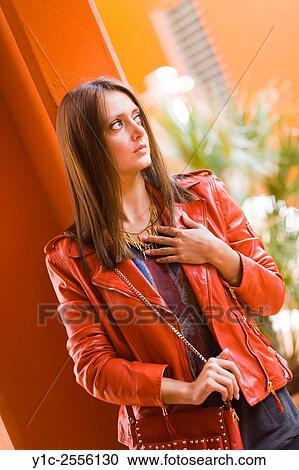 Stock Image - Stock Photo - Pretty young woman in Red jacket. Fotosearch