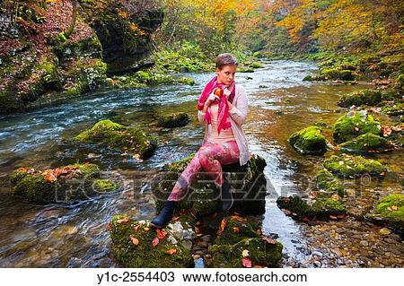 Stock Image - Stock Photo - Short-haired teenager girl on small river. Fotosearch