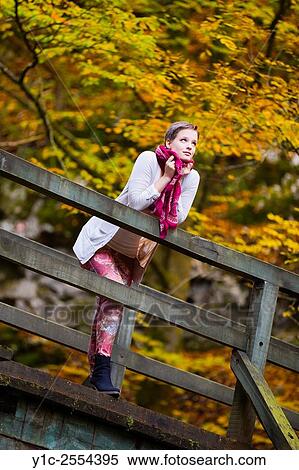 Stock Photography - Stock Photo - Short-haired teenager girl in woodland.. Fotosearch