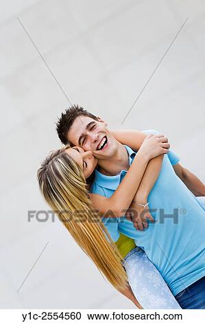 Stock Photo - Teen couple girl and boy passionate hug and kiss View Large Photo Image Stock Image - Stock Photo - Teen couple girl and boy passionate hug and kiss. Fotosearch