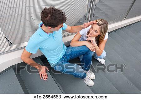 Stock Photo - Teen couple girl and boy looking each other shot from above View Large Photo Image Stock Image - Stock Photo - Teen couple girl and boy looking each other shot from above. Fotosearch