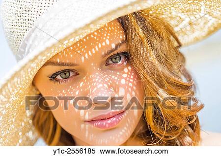 Stock Photo - Teen girl headshot under straw-hat View Large Photo Image Stock Photography - Stock Photo - Teen girl headshot under straw-hat. Fotosearch