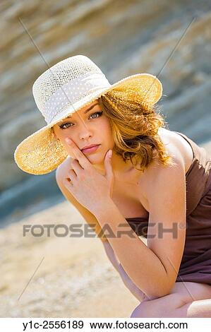 Stock Photo - Stock Photo - Teen girl portrait under straw-hat. Fotosearch