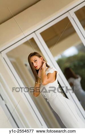 Stock Photo - Young woman in White dress framed by window View Large Photo Image Stock Photo - Stock Photo - Young woman in White dress framed by window. Fotosearch