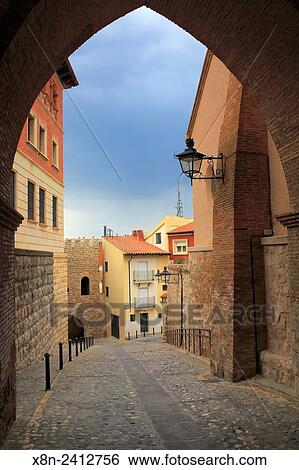 Stock Photograph - Street in old town from arch of San Martin tower, Teruel, Aragon, Spain.. Fotosearch