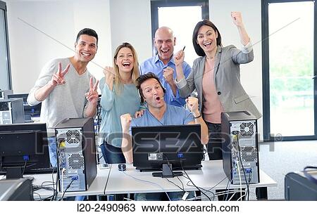 Stock Image - Team teachers. Computer Academy.. Fotosearch