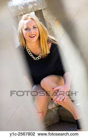 Stock Image - Teen girl is being watched. Fotosearch