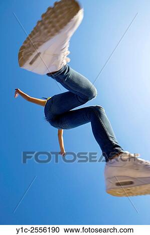Stock Image - Teenager jump for joy. Fotosearch
