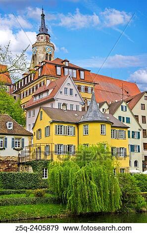 Stock Photo - The Neckar river waterfront of Tubingen, Germany, showing its landmarks the Collegiate Church and Holderlinturm tower.. Fotosearch