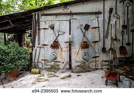 The outside of an old garden shed with antique tools hanging on the wall. Georgia USA View Large Photo Image Stock Image - The outside of an old garden shed with antique tools hanging on the wall. Georgia USA. Fotosearch