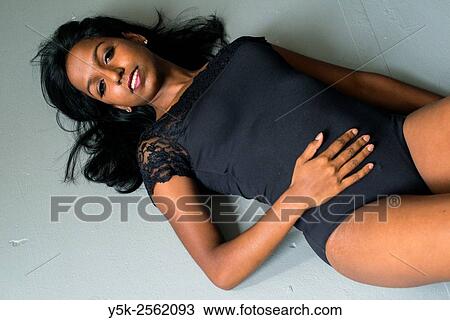 Tilburg, Netherlands. Female classical ballet dancer with Asian etnicity, lying down on studio floor, wearing only an body suit. View Large Photo Image Stock Image - Tilburg, Netherlands. Female classical ballet dancer with Asian etnicity, lying down on studio floor, wearing only an body suit.. Fotosearch
