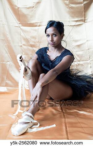 Tilburg, Netherlands. Female dancer with spitzen on her feet sitting down to mount her ballet shoes. View Large Photo Image Stock Image - Tilburg, Netherlands. Female dancer with spitzen on her feet sitting down to mount her ballet shoes.. Fotosearch