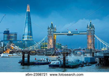 Stock Image - Tower Bridge, River Thames and The Shard skyscraper at night. London, United Kingdom, Europe.. Fotosearch