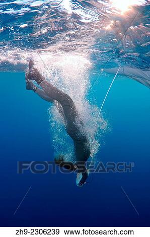 Traditional diving with petra (stone) for sponges, Aegean Sea, island Symi, Greece. View Large Photo Image Stock Photo - Traditional diving with petra (stone) for sponges, Aegean Sea, island Symi, Greece.. Fotosearch