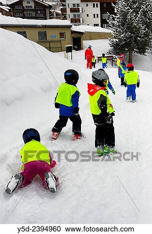 very small kids - 3-4 years old coming back to hotel after first lessons of skiing, Saas-Fee, Valais, Switzerland. View Large Photo Image Stock Image - very small kids - 3-4 years old coming back to hotel after first lessons of skiing, Saas-Fee, Valais, Switzerland.. Fotosearch